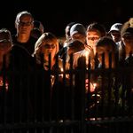 Family members and friends gather for a candlelight vigil memorial at Mohawk Valley Gateway Overlook Pedestrian Bridge in Amsterdam, N.Y., . The memorial honored 20 people who died in Saturday's fatal limousine crash in Schoharie, N.Y<br>